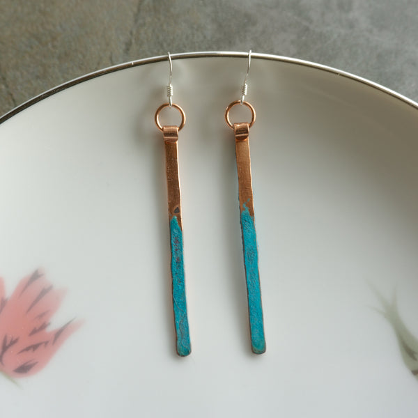 Long store stick earrings